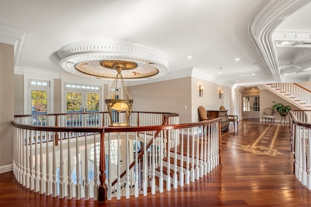 corridor with french doors, ornamental molding, and dark hardwood / wood-style flooring