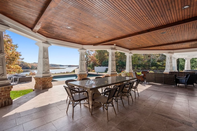 view of patio / terrace featuring a water view and an outdoor hangout area