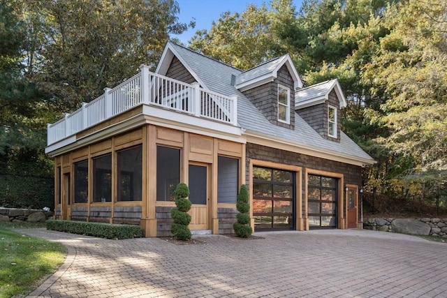 150 Horseneck Rd, Dartmouth, MA 02748 - view of front of home featuring a balcony, a garage, and decorative driveway