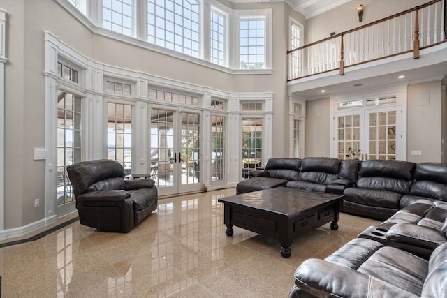 150 Horseneck Rd, Dartmouth, MA 02748 - living room with french doors, a high ceiling, granite tiled floors, crown molding, and plenty of natural light