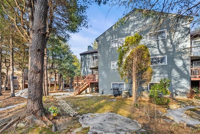 view of property exterior featuring stairs