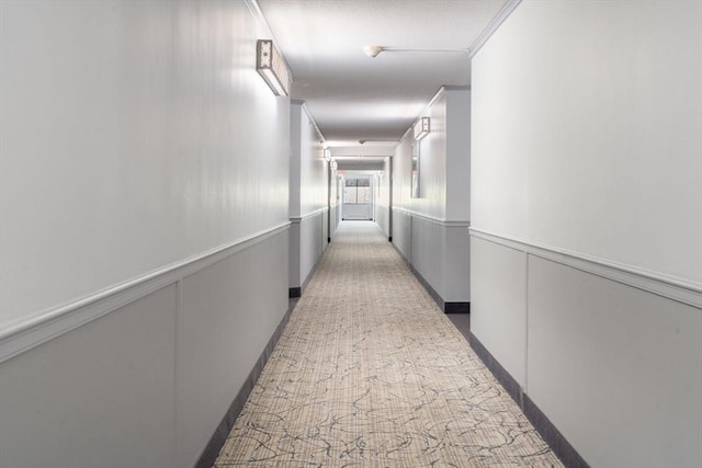 corridor with carpet flooring
