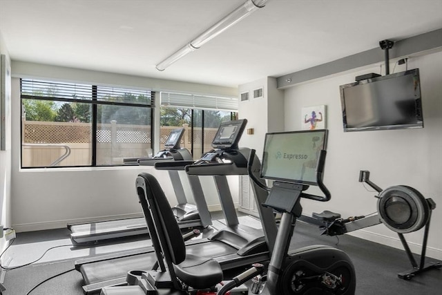 gym featuring baseboards