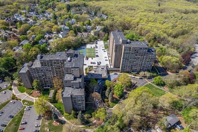 aerial view of property's location with a heavily wooded area