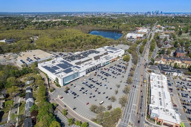 aerial view of property and surrounding area with a highway and a large body of water