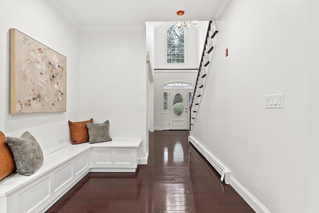 261 E St, Foxboro, MA 02035 - entrance foyer featuring a baseboard radiator, stairway, dark wood-style floors, and ornamental molding