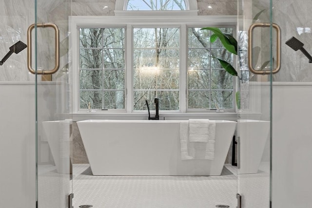 261 E St, Foxboro, MA 02035 - bathroom featuring a soaking tub and a shower stall