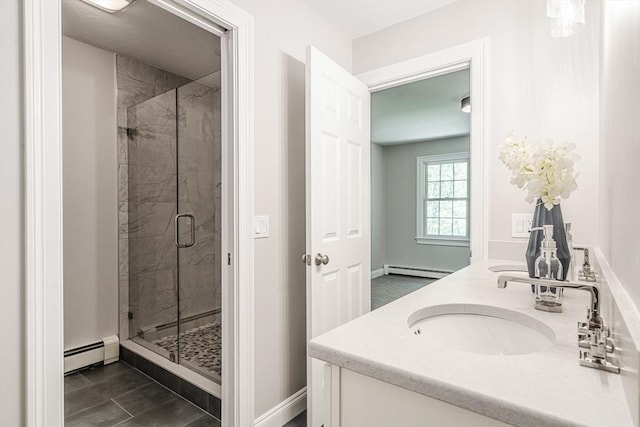 261 E St, Foxboro, MA 02035 - bathroom featuring a baseboard radiator, a stall shower, and double vanity