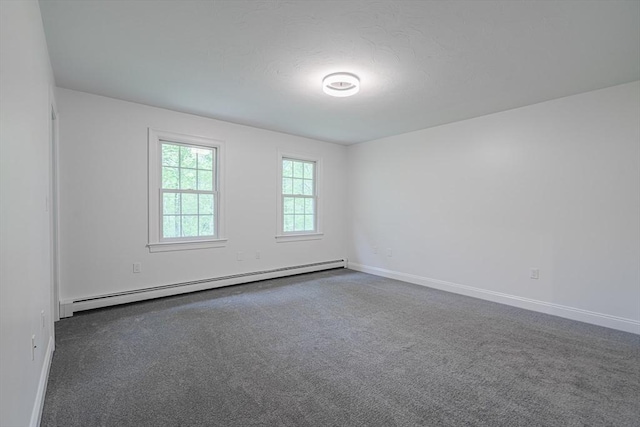 261 E St, Foxboro, MA 02035 - carpeted empty room featuring a baseboard heating unit and baseboards