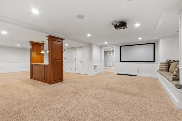 261 E St, Foxboro, MA 02035 - home theater room featuring light colored carpet, ornamental molding, a decorative wall, and recessed lighting