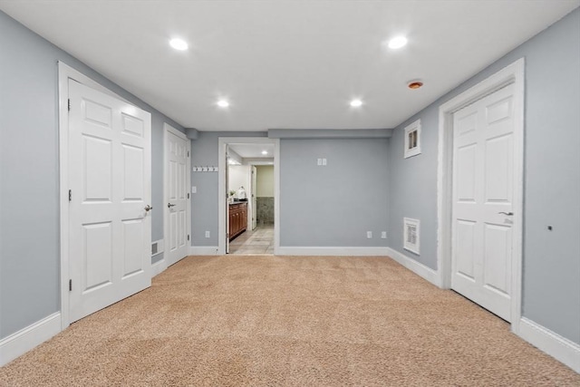 261 E St, Foxboro, MA 02035 - finished basement with light carpet and recessed lighting