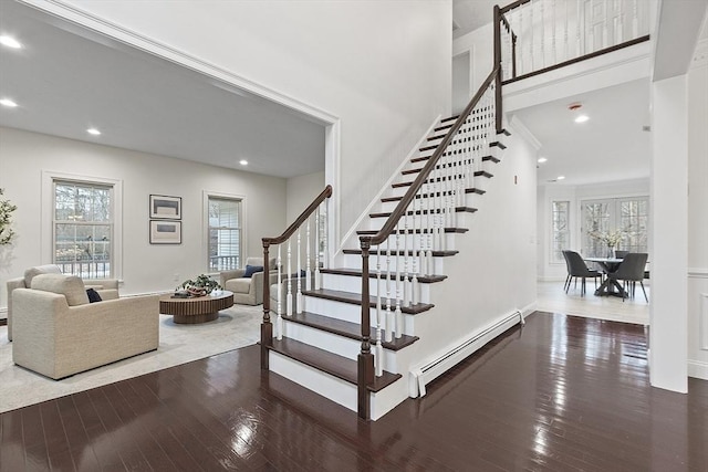 261 E St, Foxboro, MA 02035 - staircase with a baseboard radiator, plenty of natural light, wood-type flooring, and recessed lighting