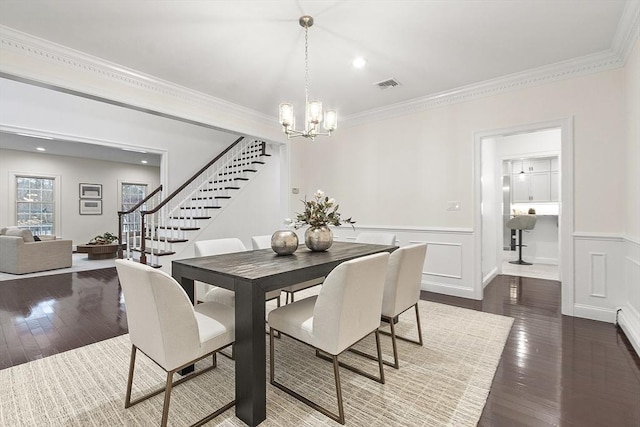 261 E St, Foxboro, MA 02035 - dining room featuring stairway, a chandelier, wood-type flooring, ornamental molding, and wainscoting