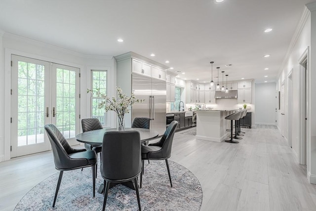 261 E St, Foxboro, MA 02035 - dining area with french doors, ornamental molding, recessed lighting, and light wood-style flooring