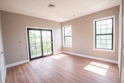 spare room featuring light hardwood / wood-style flooring