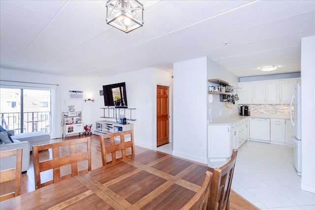 dining area featuring light tile patterned flooring