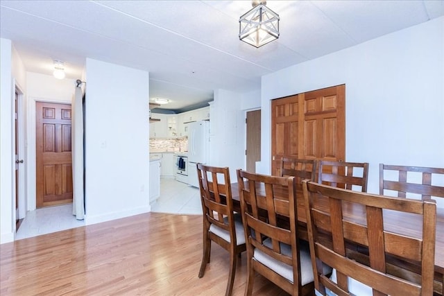 dining room featuring light wood-style flooring