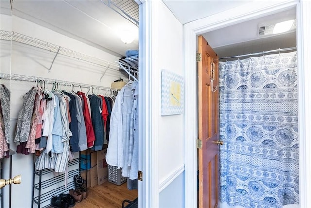 spacious closet featuring wood finished floors