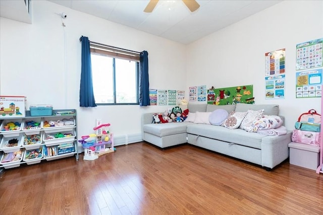 playroom featuring wood finished floors and a ceiling fan