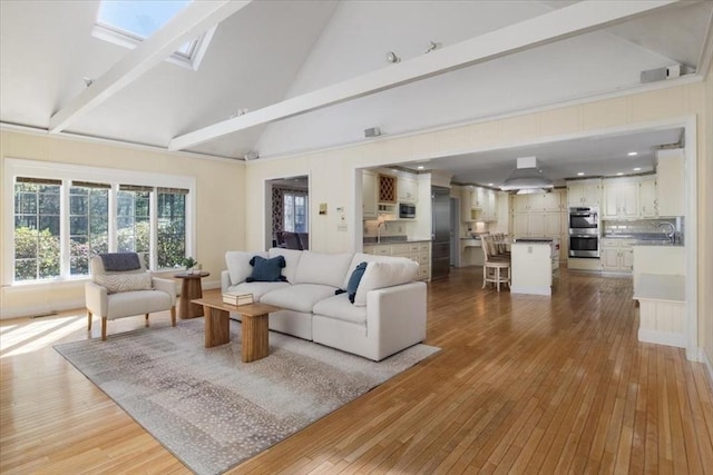 living room with beamed ceiling, high vaulted ceiling, and wood-type flooring