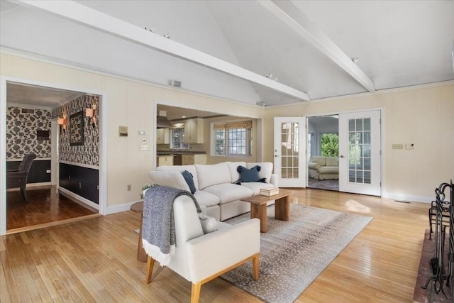 living room with french doors, wood finished floors, baseboards, high vaulted ceiling, and beamed ceiling