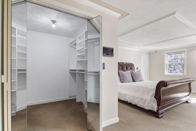 bedroom with carpet floors, baseboards, and two closets