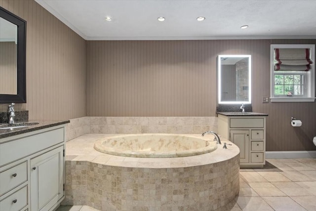 full bathroom with a bath, crown molding, tile patterned flooring, two vanities, and a sink