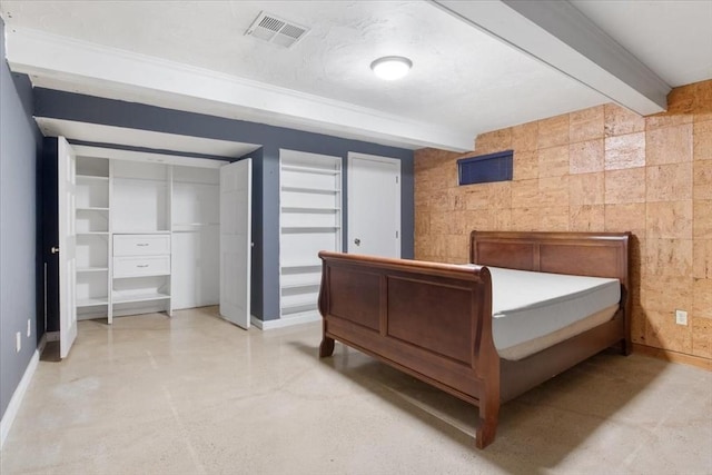 bedroom featuring beamed ceiling, baseboards, and visible vents