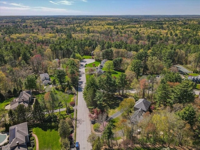 birds eye view of property with a forest view