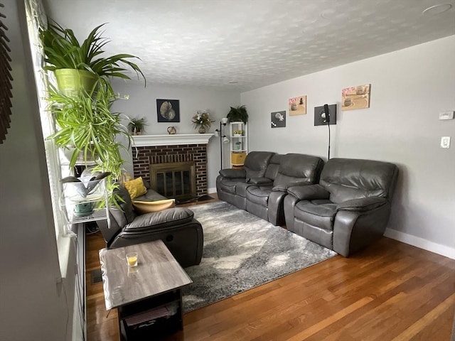 412 Worcester St, West Boylston, MA 01583 - living area featuring a textured ceiling, a fireplace, and wood finished floors