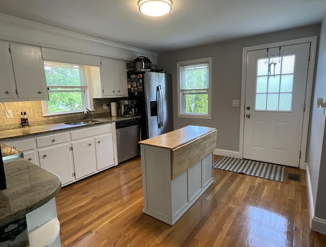 412 Worcester St, West Boylston, MA 01583 - kitchen with stainless steel appliances, healthy amount of natural light, and light wood-style flooring