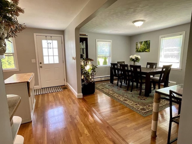 412 Worcester St, West Boylston, MA 01583 - dining room with light wood-type flooring and baseboard heating