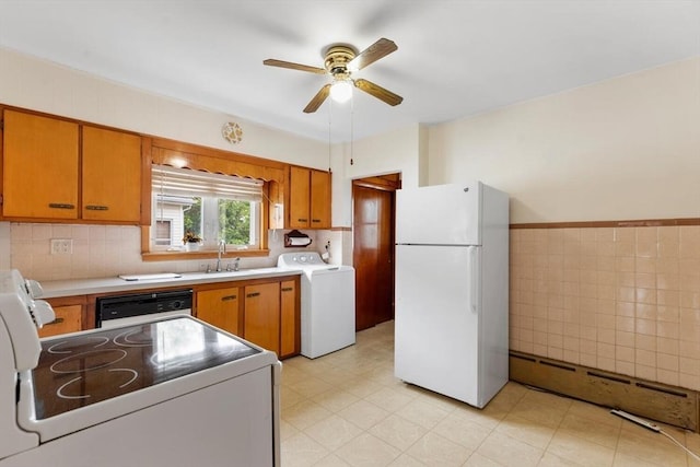 130 Francis St, Everett, MA 02149 - kitchen with white appliances, washer / clothes dryer, a ceiling fan, a baseboard radiator, and light countertops