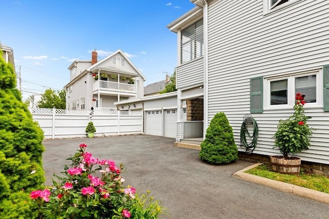 130 Francis St, Everett, MA 02149 - view of home's exterior featuring driveway and a garage