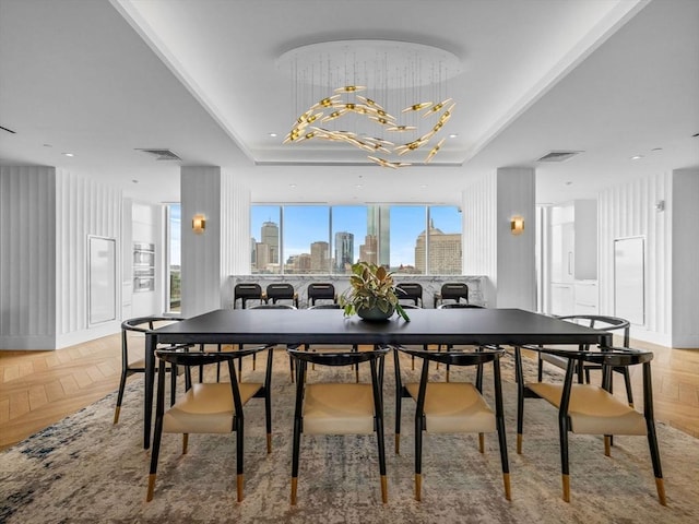 100 Shawmut Ave Unit 709, Boston, MA 02118 - dining space with a tray ceiling, a chandelier, and a skyline view