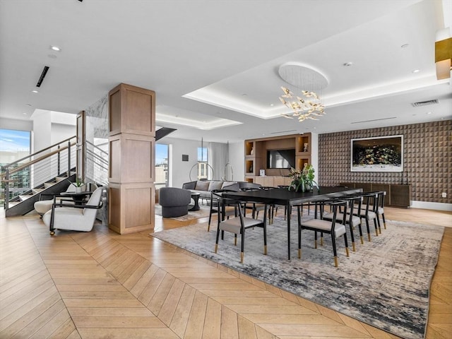 100 Shawmut Ave Unit 709, Boston, MA 02118 - dining space featuring a chandelier, stairs, and a raised ceiling