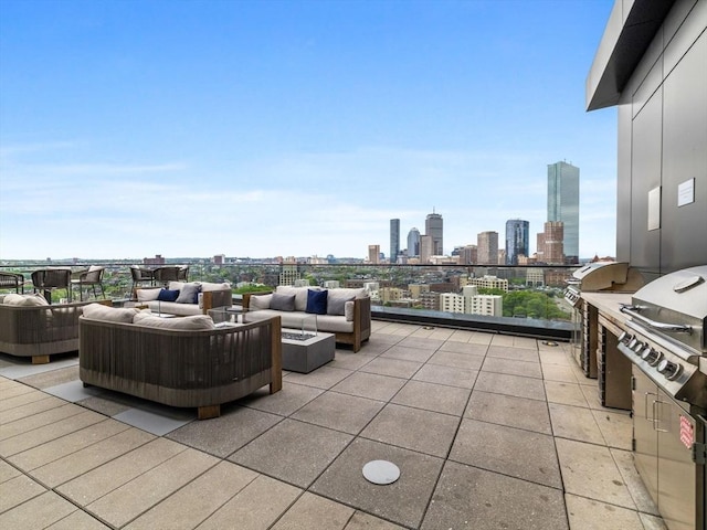 100 Shawmut Ave Unit 709, Boston, MA 02118 - view of patio / terrace with an outdoor living space with a fire pit and a skyline view