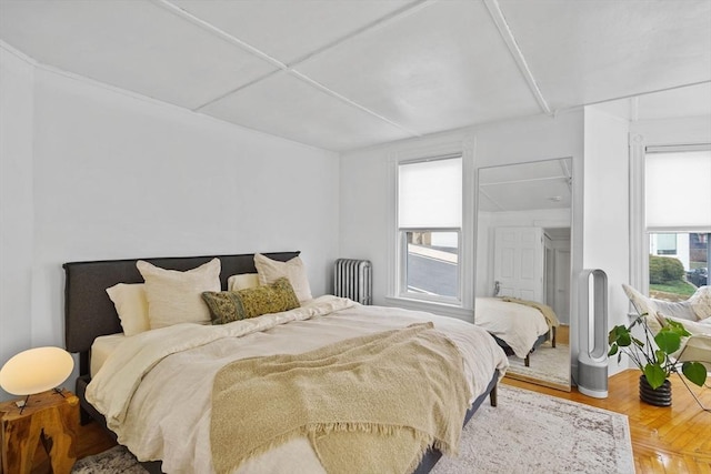 bedroom with wood finished floors