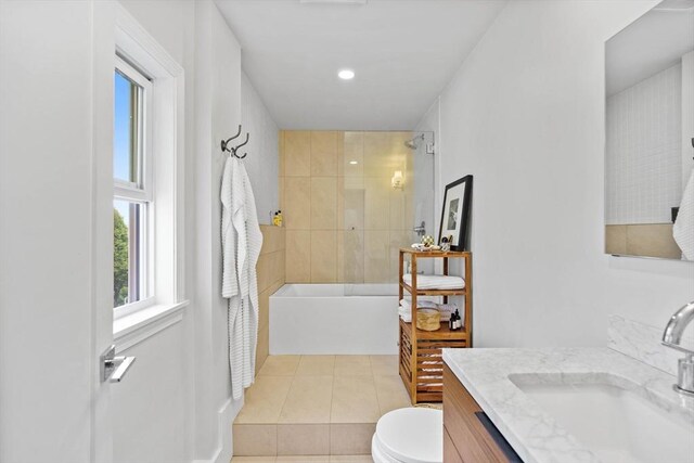 bathroom with toilet, tile patterned flooring, and vanity
