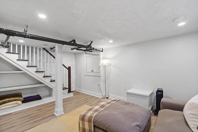 interior space with stairs, baseboards, light wood-type flooring, and recessed lighting