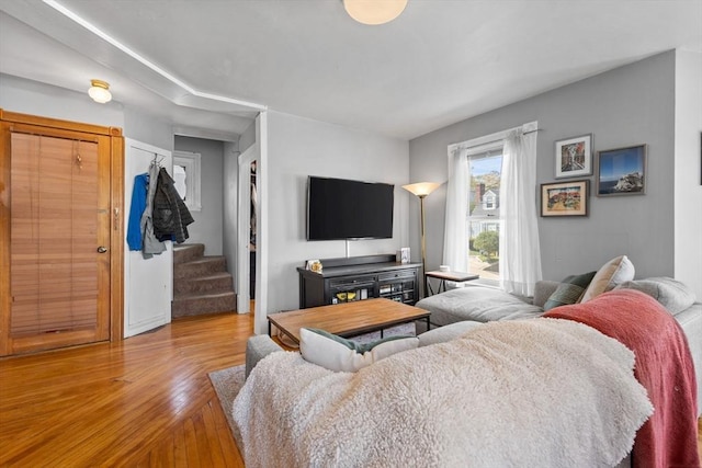 living room featuring stairway and wood finished floors