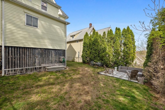 view of yard with a patio area, outdoor lounge area, and fence