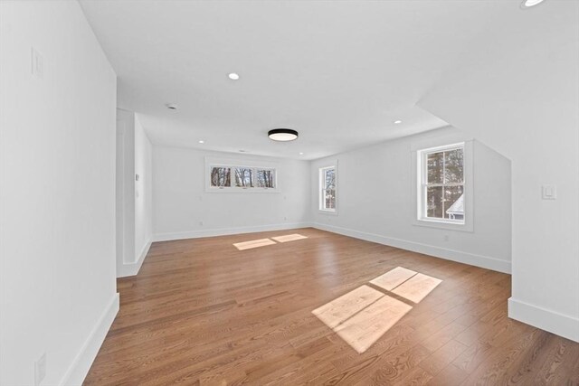 unfurnished room featuring recessed lighting, baseboards, and light wood finished floors