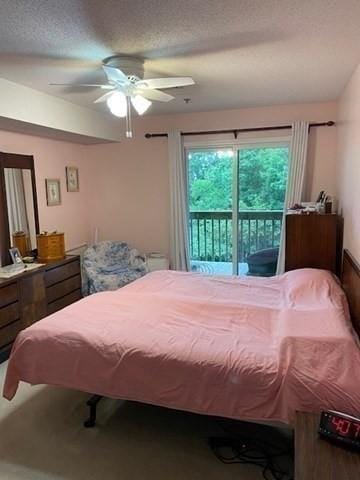 4 Duck Pond Rd Unit 219, Beverly, MA 01915 - bedroom with access to exterior, ceiling fan, and a textured ceiling