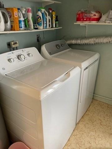 4 Duck Pond Rd Unit 219, Beverly, MA 01915 - laundry area featuring separate washer and dryer and baseboards