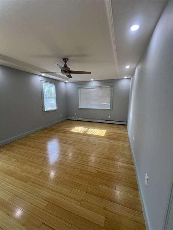 unfurnished bedroom featuring baseboards, light wood-style floors, and recessed lighting
