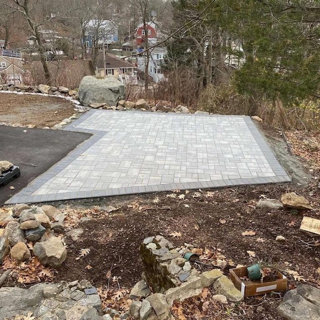 entry to storm shelter with a patio area