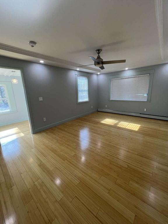 unfurnished bedroom with light wood-type flooring, baseboards, recessed lighting, and ceiling fan