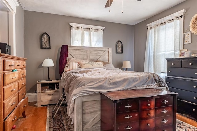 bedroom with hardwood / wood-style flooring and ceiling fan