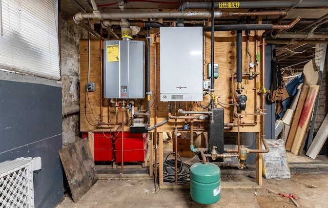 utility room featuring water heater